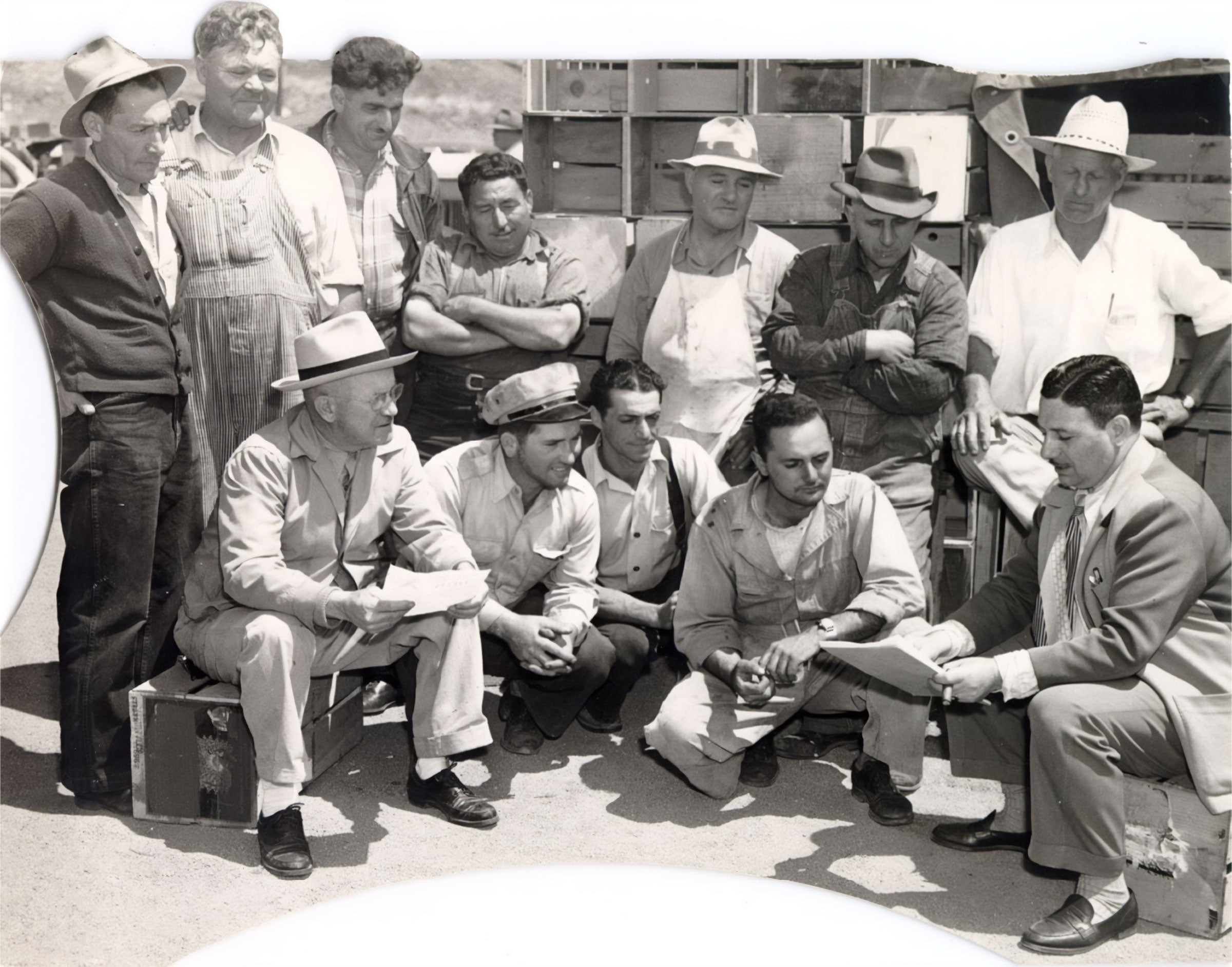 Black and white image of John Brucato and farmers' market workers